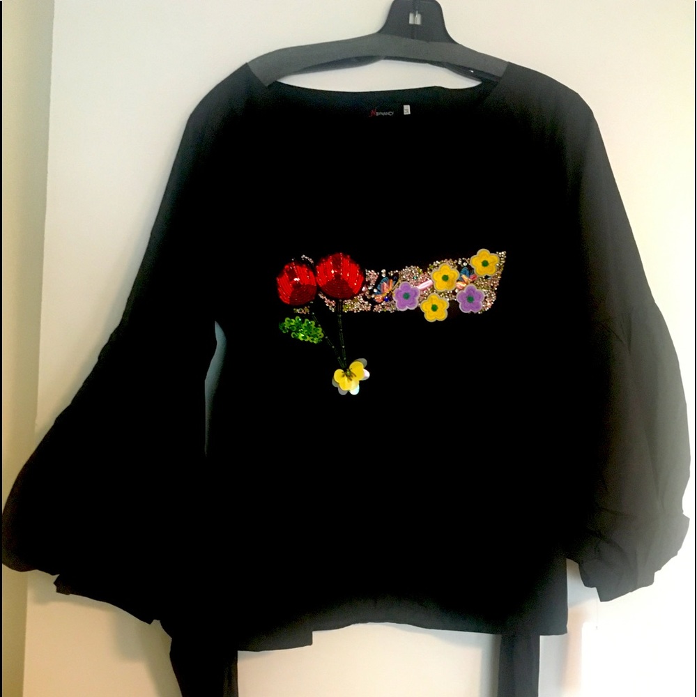 Black long sleeve top with appliqué